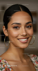 Elegant Smiling Woman with Bright Expression and Hoop Earrings