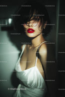Elegant Woman with Red Lips in Stylish Evening Dress