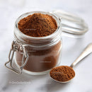 Glass Jar Filled with Fine Ground Coffee and Coffee Beans