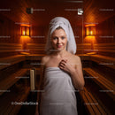 Relaxing Woman in Spa Sauna with Wooden Interior and Warm Lighting