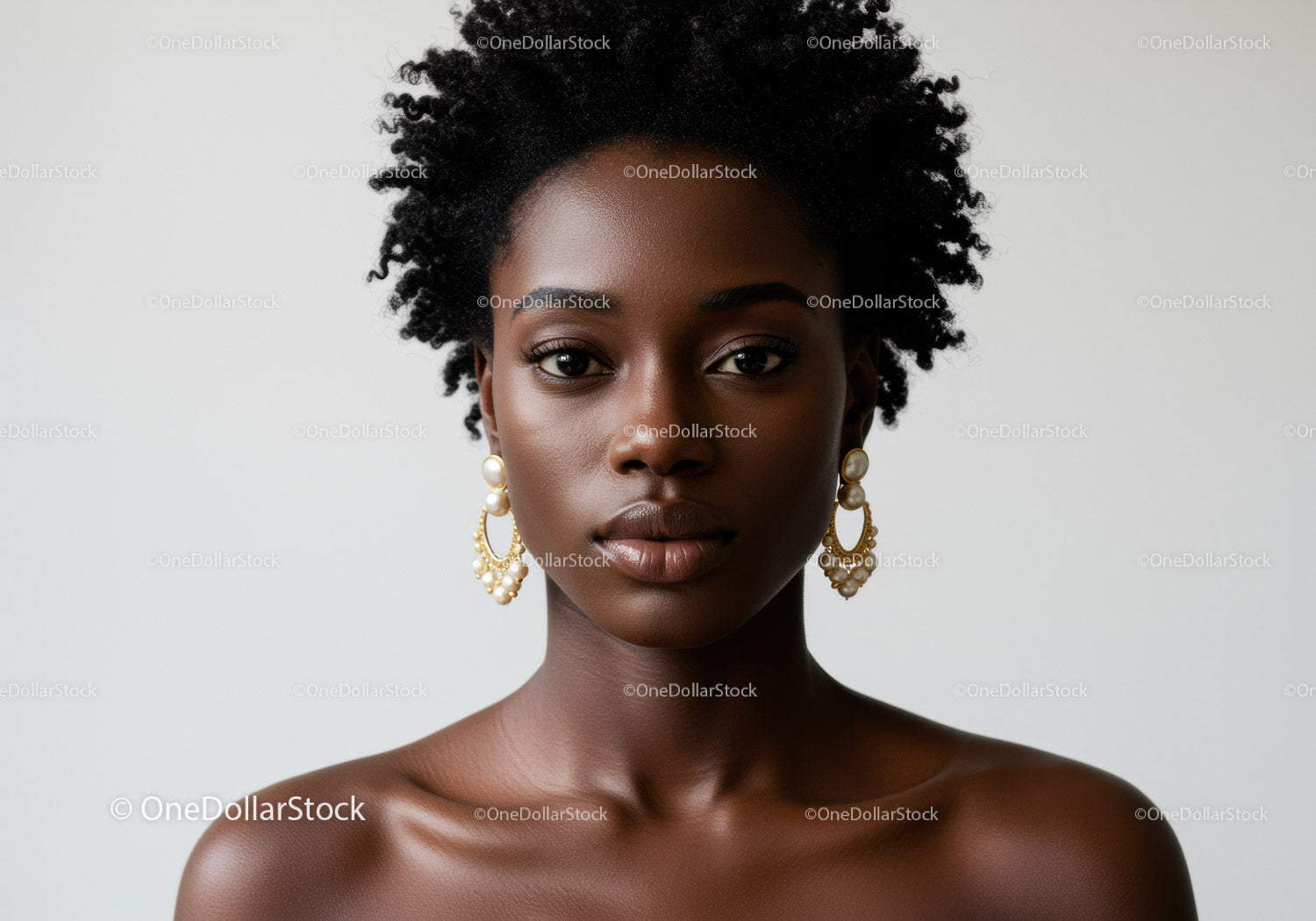 Elegant Black Woman with Natural Curly Hair and Pearl Earrings
