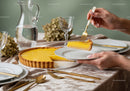 Fresh Lemon Tart with Velvety Filling and Flaky Crust on Elegant Table