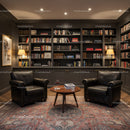 Cozy reading nook with leather chairs and bookshelves