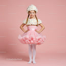 Little girl in pink tutu and whipped cream costume