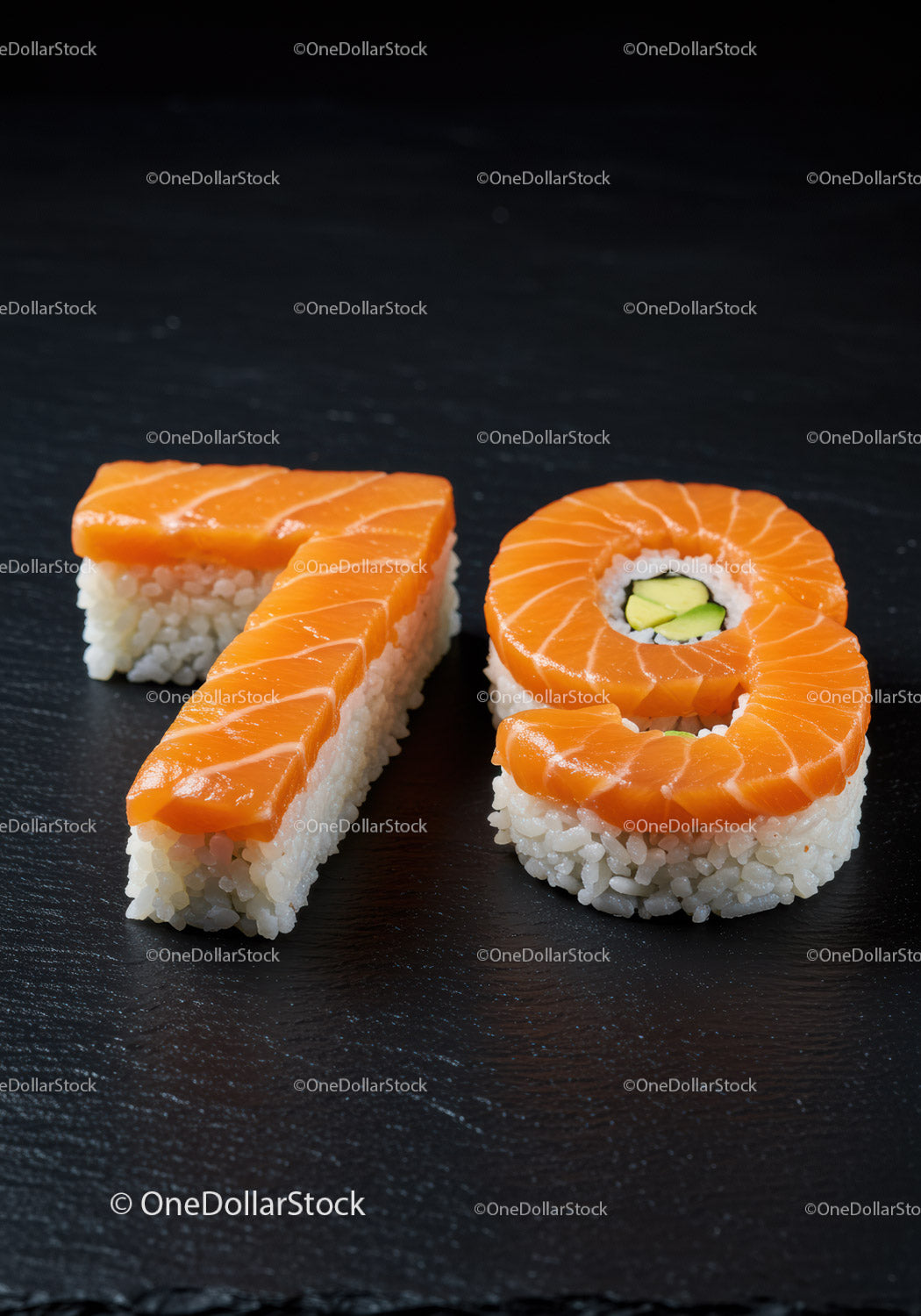 Numbers 7 and 9 crafted from fresh sushi on black slate