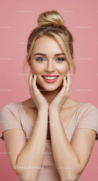Portrait of a Happy Woman with Blonde Hair Against Pink Background