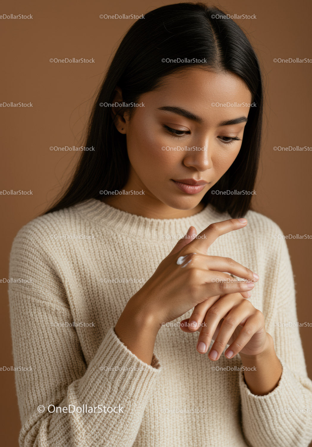 Young Woman Applying Skincare in Cozy Indoor Setting