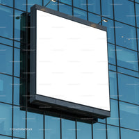 Blank white billboard on modern office building facade
