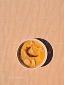 Bowl of tropical fruit dessert with hibiscus flower