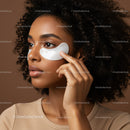 Young Black Woman Using Under Eye Patches for Beauty Care