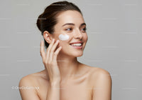 Young Woman Applying Facial Moisturizer for Healthy Skin