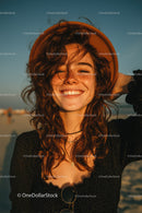 Sunlit Woman with Red Hair Smiling in Summer Sun at the Beach