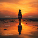 Silhouette of a Child at Sunset by the Ocean Shore