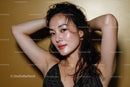 Glamorous Young Woman with Wet Hair and Gold Jewelry in Close-Up