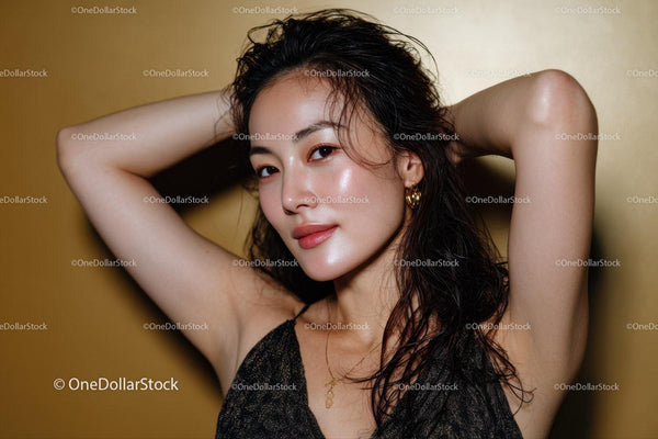 Glamorous Young Woman with Wet Hair and Gold Jewelry in Close-Up