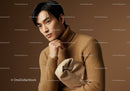 Elegant Young Man in Beige Turtleneck with Brown Background