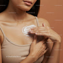 Close-up of Woman Applying Cream on Chest for Skin Care and Moisturization