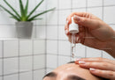 Woman Receiving Facial Oil Application for Skin Rejuvenation