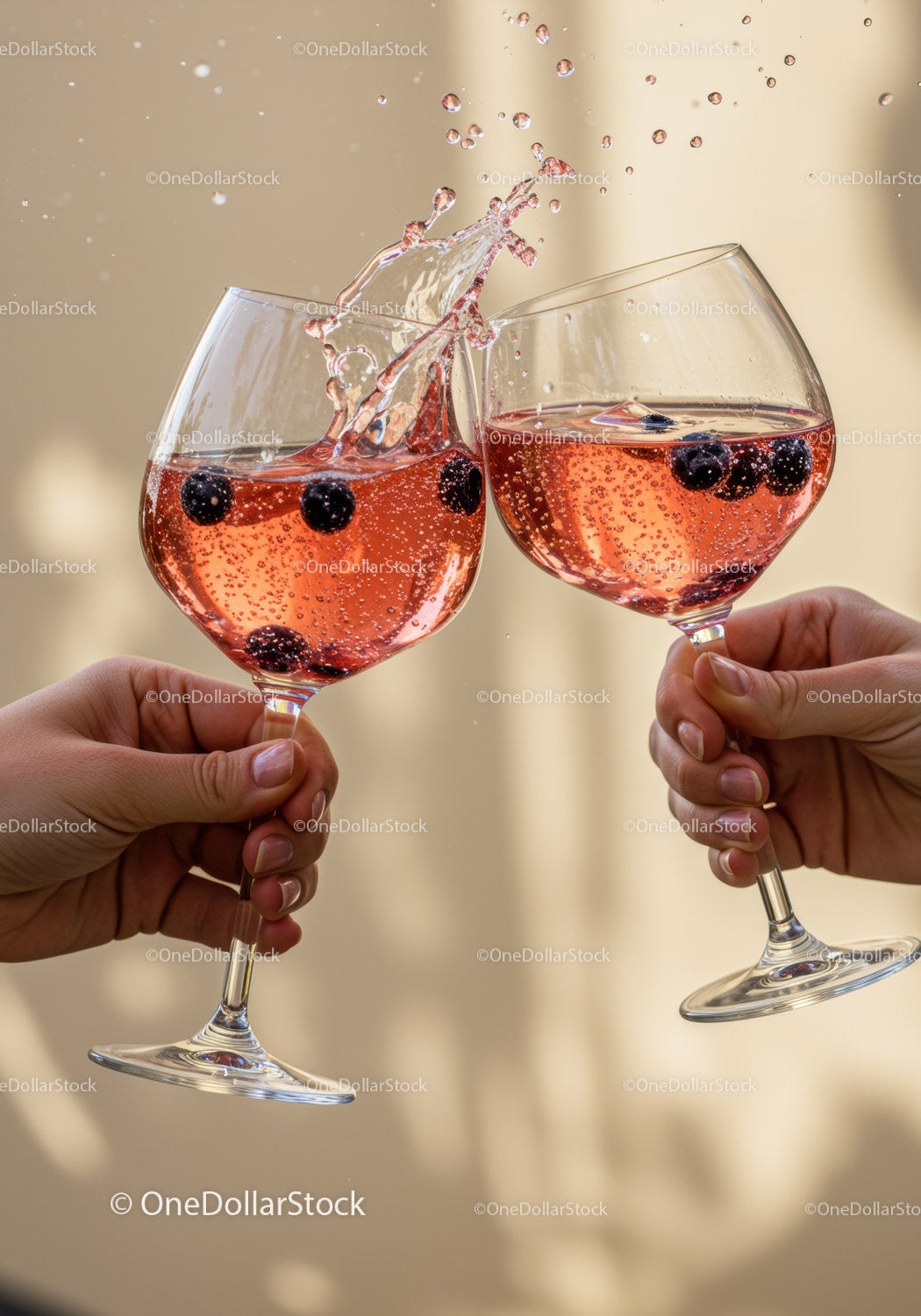 Two people clinking glasses of sparkling berry drink