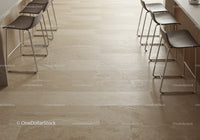 Stylish Modern Cafe Bar Area with Beige Tiles and Black Chairs