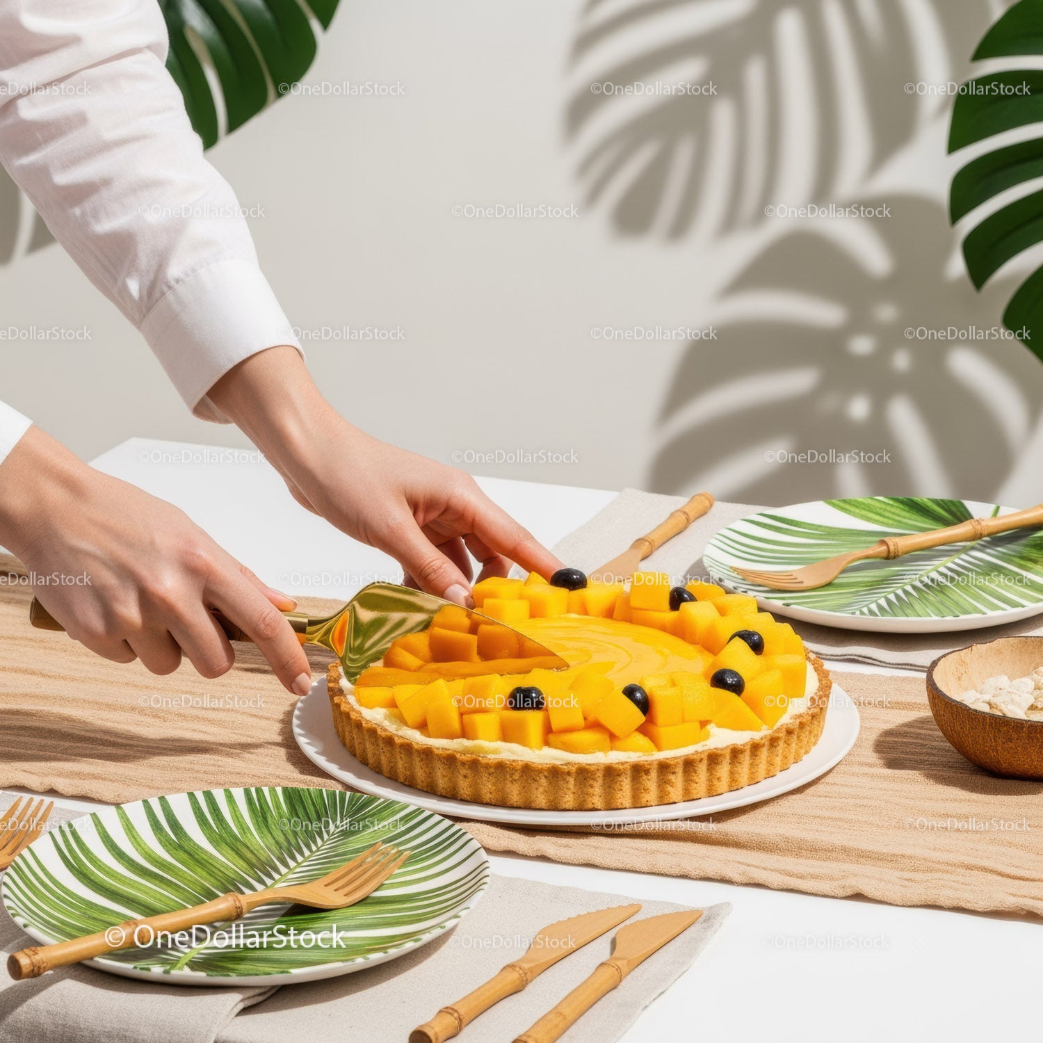 Fresh Mango Fruit Tart with Black Olives and Tropical Decoration