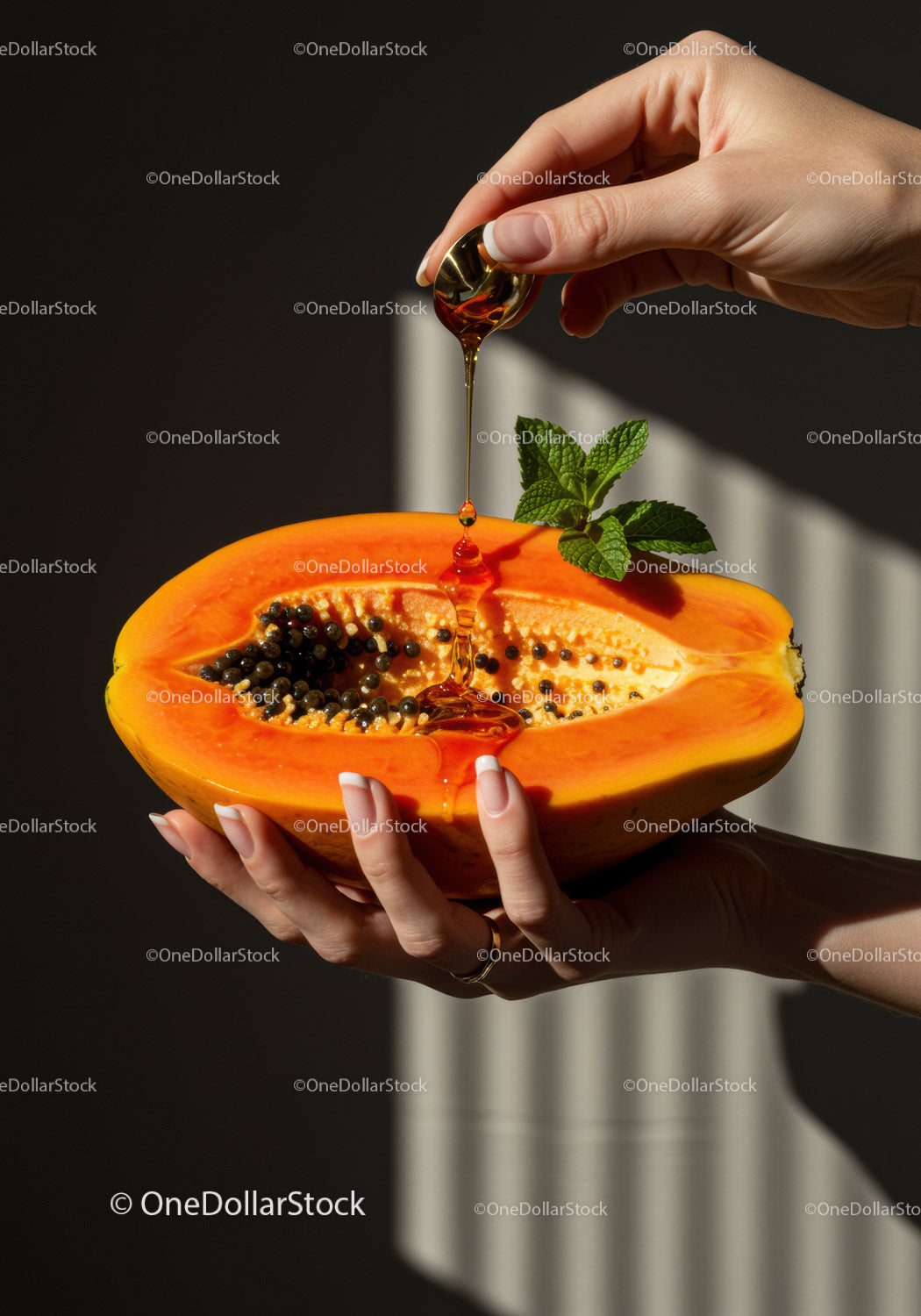 Fresh Papaya with Honey Drizzle and Mint Leaves