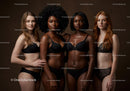 Diverse women in elegant black lingerie standing together