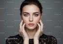 Close-up Portrait of a Beautiful Woman with Clear Skin and Blue Eyes