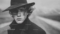 Black and White Fashion Portrait of Young Man with Windblown Hair