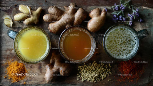 Variety of Herbal Drinks Featuring Fresh Ginger and Spices