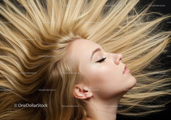 Blonde woman with flowing hair in profile on dark background