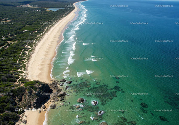 Aerial View of Pristine Sandy Beach with Turquoise Waters and Rocky Coast