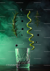 Fresh Ingredients Suspended Above Glass with Misty Background