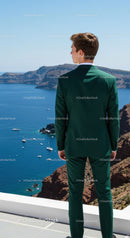 Man in Green Suit Overlooking Scenic Coastal Landscape