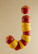 Creative mix of apples and orange peels forming a curved line