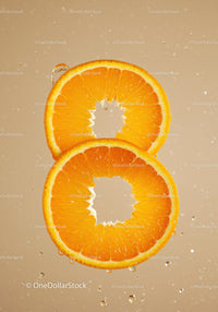 Fresh Orange Slices Immersed in Water Splash