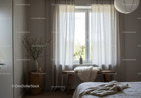 Cozy modern bedroom with soft natural light and decor