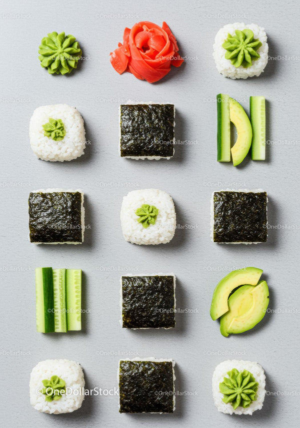 Minimalist flat lay of fresh sushi ingredients on gray