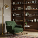 Cozy Green Armchair Corner with Wooden Shelves and Lamp