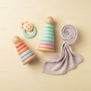 Soft pastel baby toys with cozy muslin cloth
