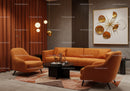 Modern Living Room with Warm Orange Seating and Art