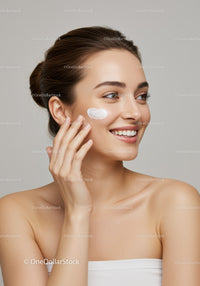 Young Woman Applying Face Cream for Healthy Glowing Skin
