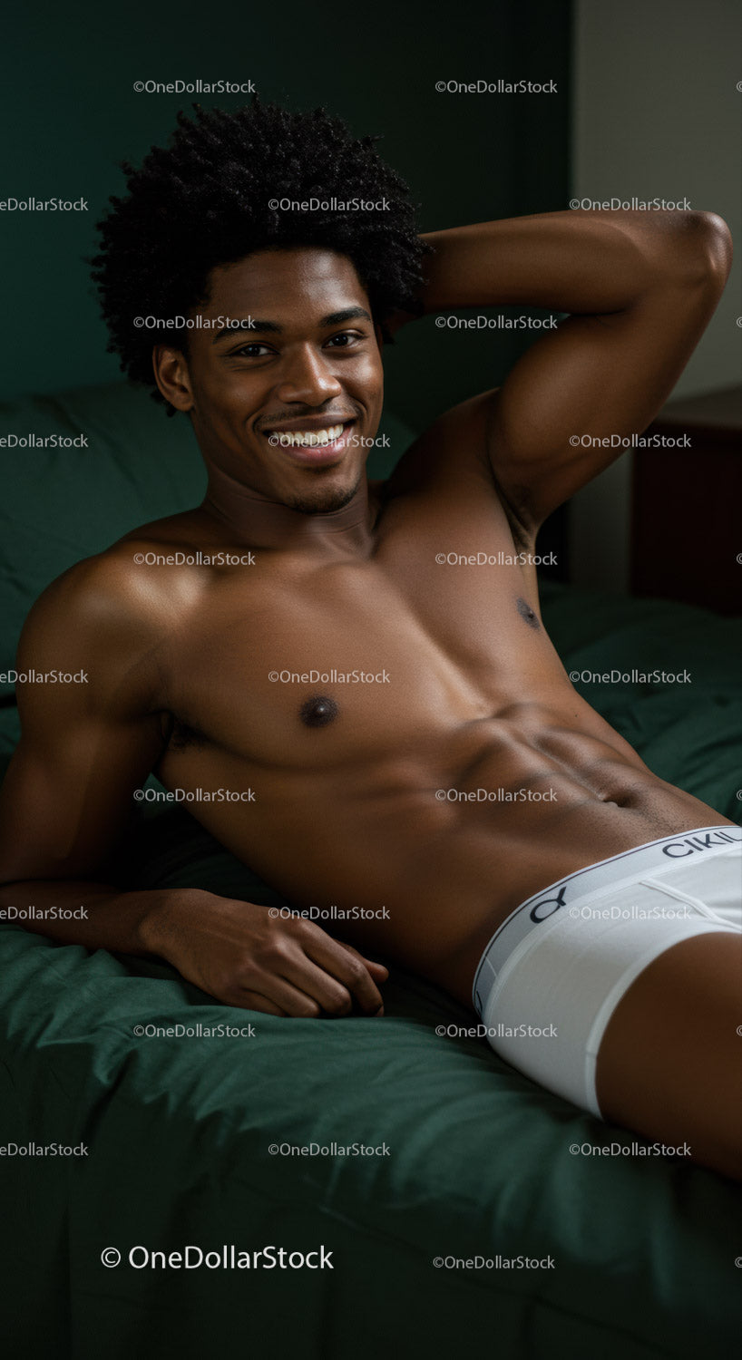 Relaxed young man lying on bed with confident smile