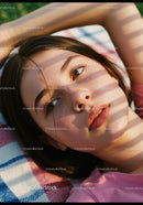 Close-up of thoughtful young woman resting outdoors