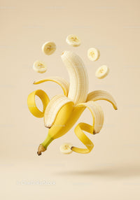 Peeled banana with floating slices on beige background