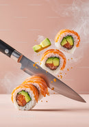 Fresh salmon sushi rolls sliced with knife in motion