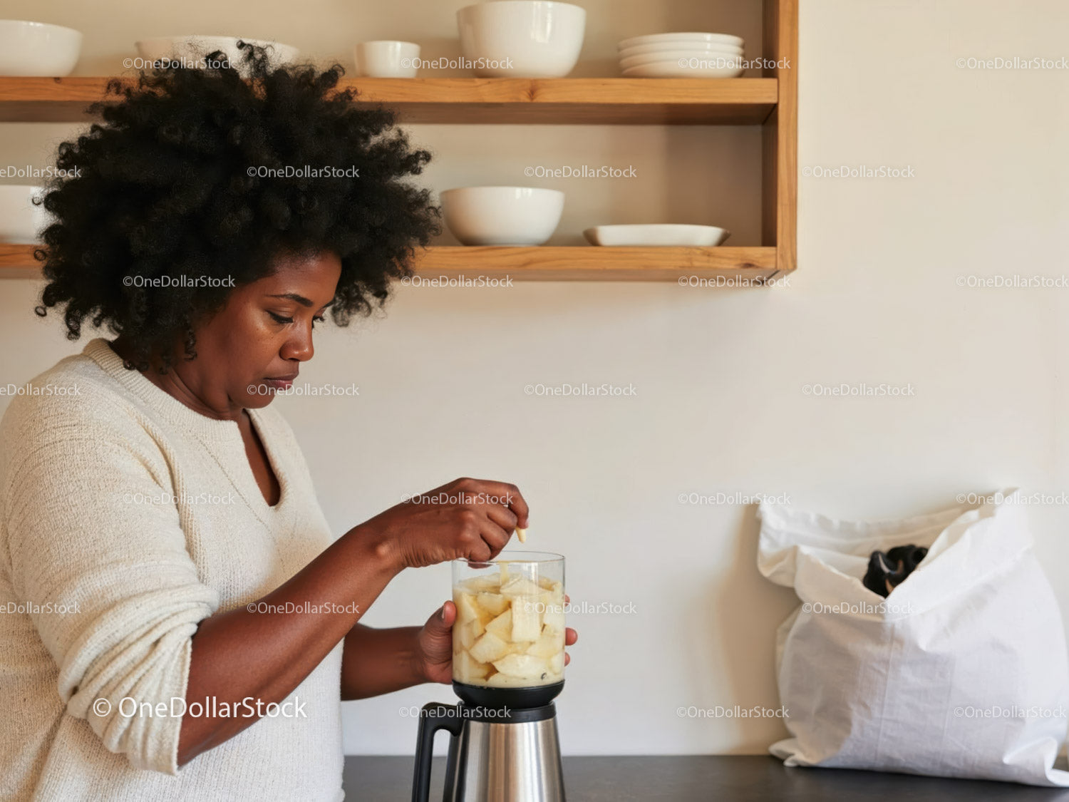 Woman Preparing Fruit Smoothie in Modern Kitchen