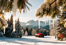 Snowy cabin with red roof in serene winter mountains