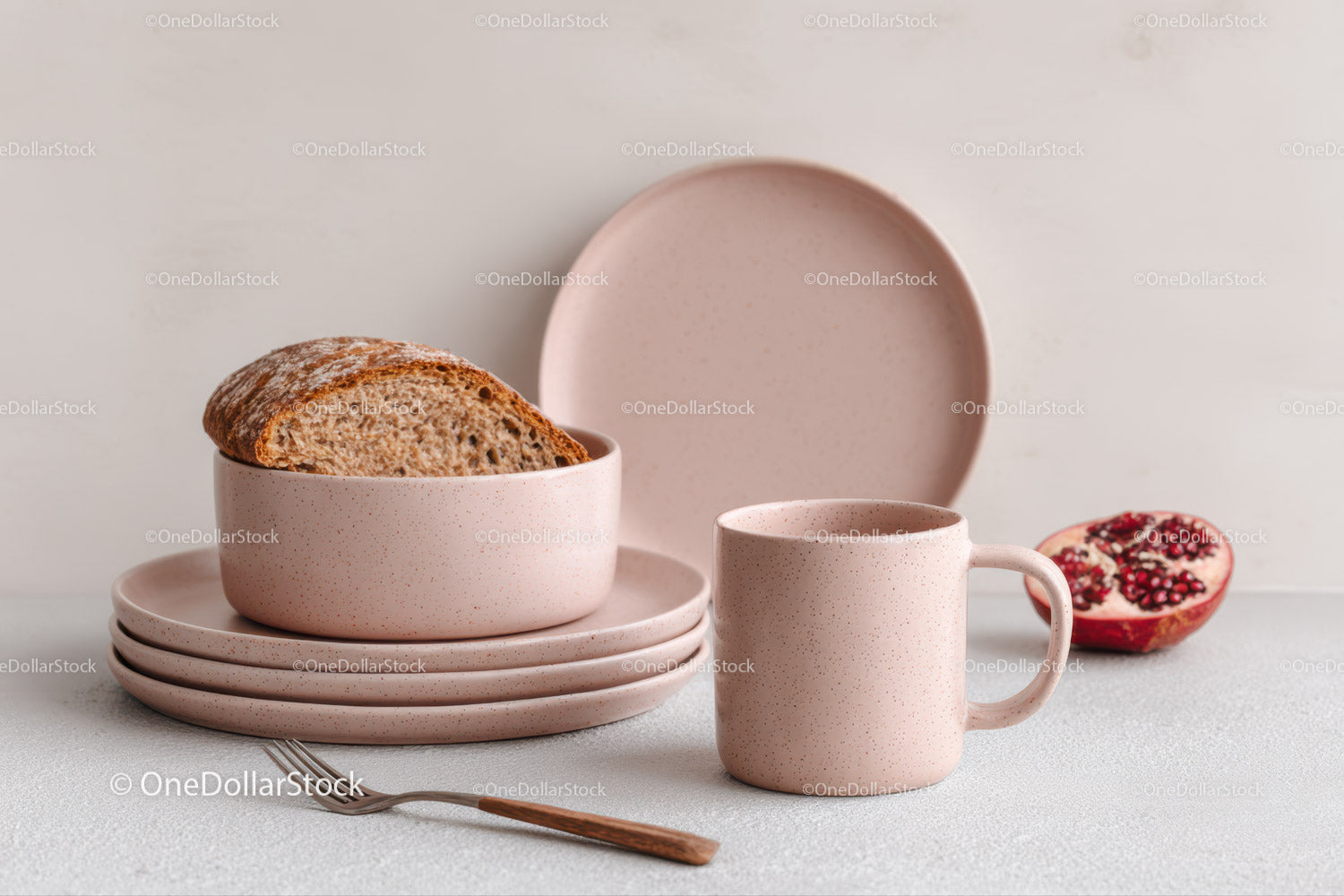 Pink Speckled Ceramic Dishware Set with Bread and Pomegranate