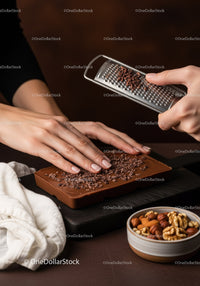 Chocolate Bar with Cocoa Nibs and Assorted Nuts on Wooden Surface